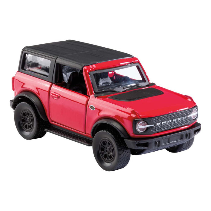 The Rollin' 2021 Ford Bronco is a red toy SUV with a black roof and wheels, detailed headlights, side mirrors, and a rugged design. This realistic model by Rollin' is shown angled to display its front and side.