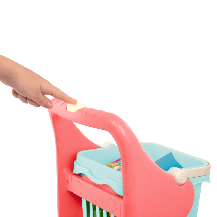 Toy shopping cart with groceries.