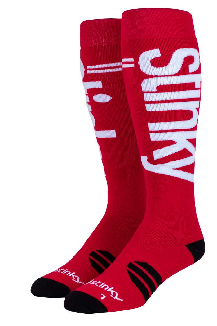 Red socks with 'Stinky' branding on a white background