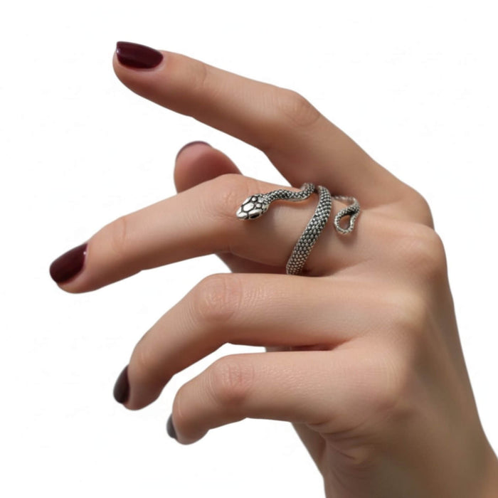 woman wearing middle finger Silver Heads Up Snake Wrap Ring with raised snake head and textured open band size 8