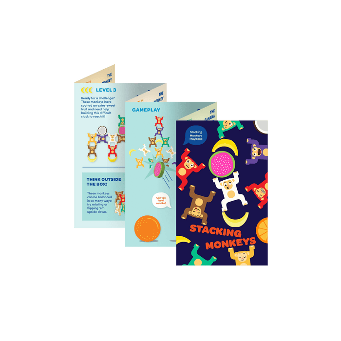 Colorful stacked monkey and fruit toys with a booklet.