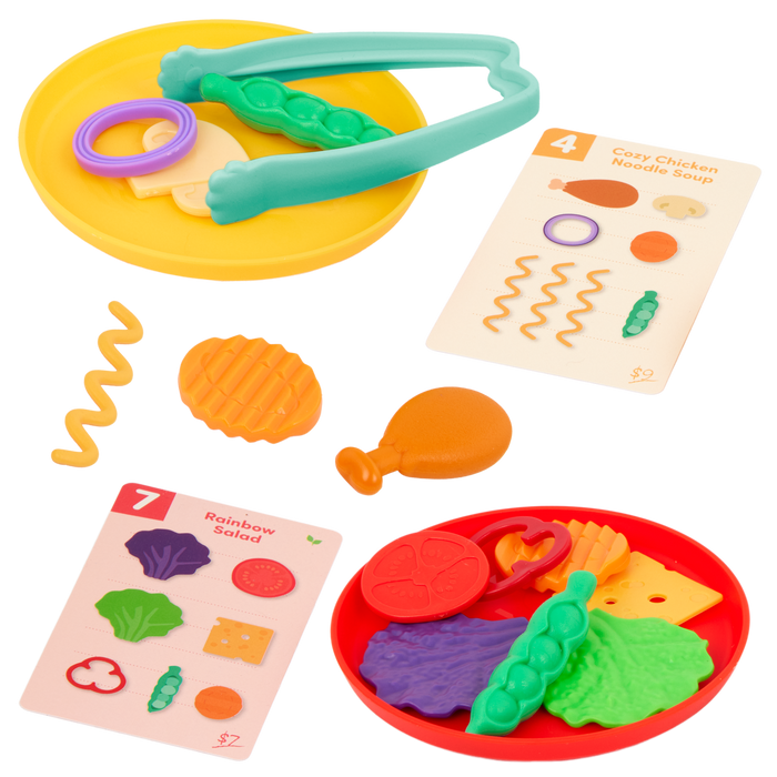 Colorful food sorting game with tongs, play food, activity cards, bowls, and a menu.