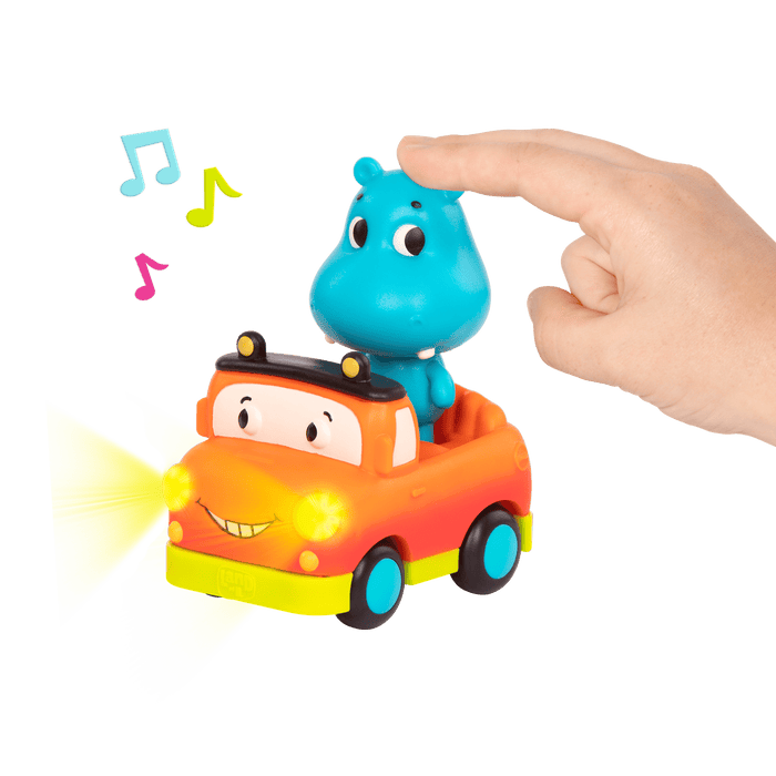 Light-up toy hippo in pickup truck