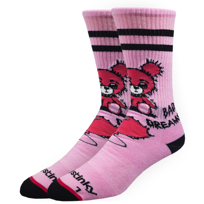 Pink socks with cartoon character and text on a white background