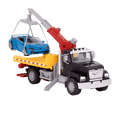 Black toy tow truck towing blue car