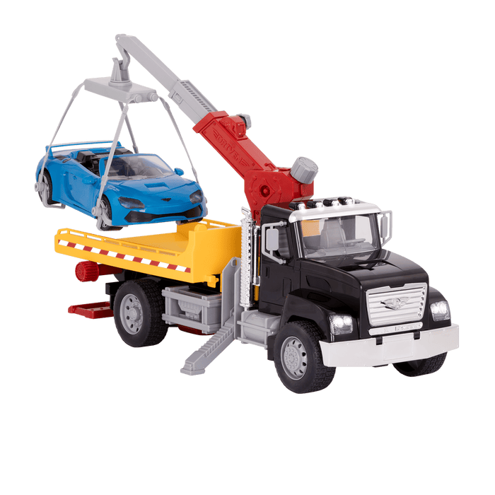Black toy tow truck towing blue car