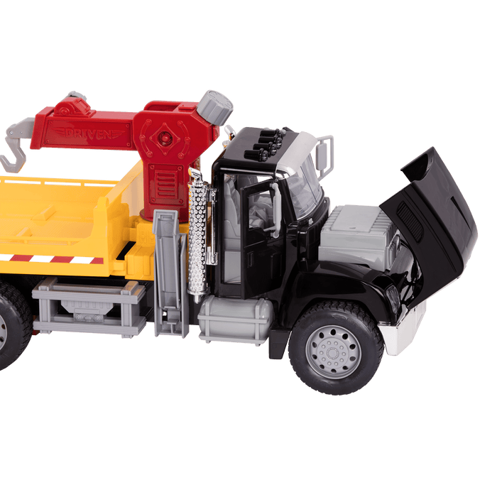 Black toy tow truck towing blue car