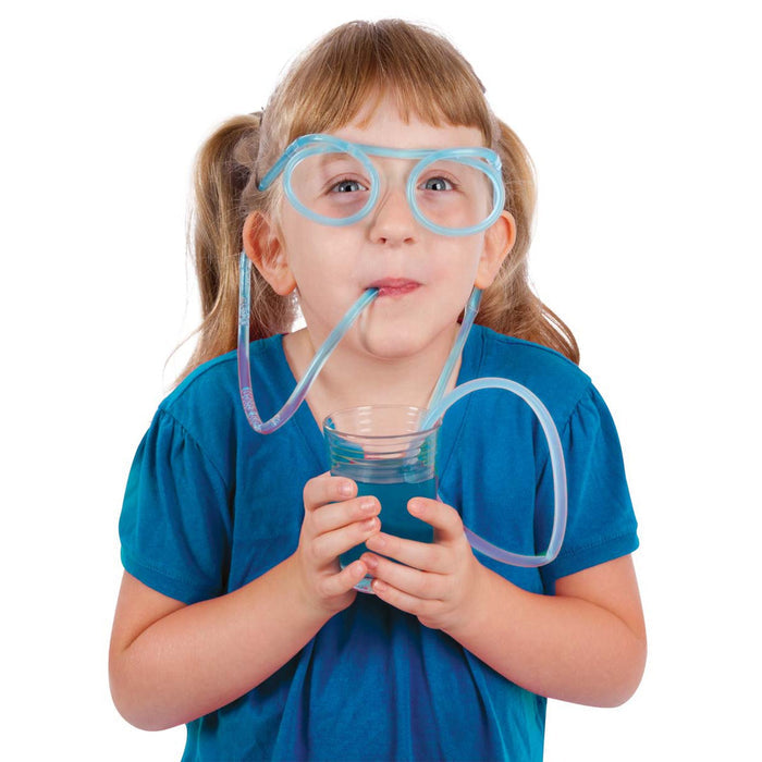 A young child smiles and looks upward while drinking blue liquid from a clear glass using Toysmith Sippin' Specs straw glasses by Toysmith, set against a white background.