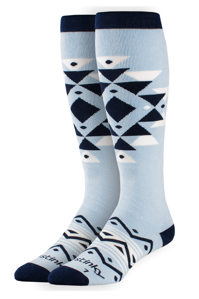 Pair of light blue knee-high socks with geometric pattern on a white background