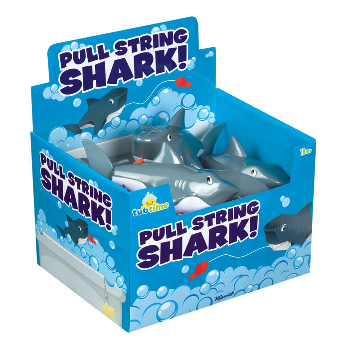 A blue display box labeled "Tub Time Pull-String Shark" by Tub Time holds several gray interactive bath toy sharks with white teeth and eyes, surrounded by cartoon bubbles and fish illustrations.