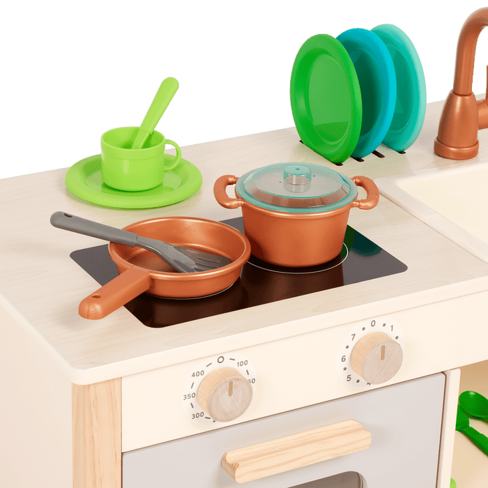 Wooden toy kitchen with colorful accessories.