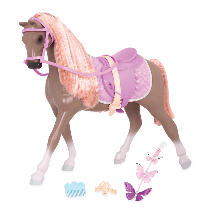 Light brown and peach horse with saddle and accessories